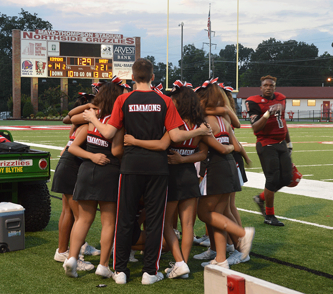 Cheer Team Overcomes Loss and Injuries